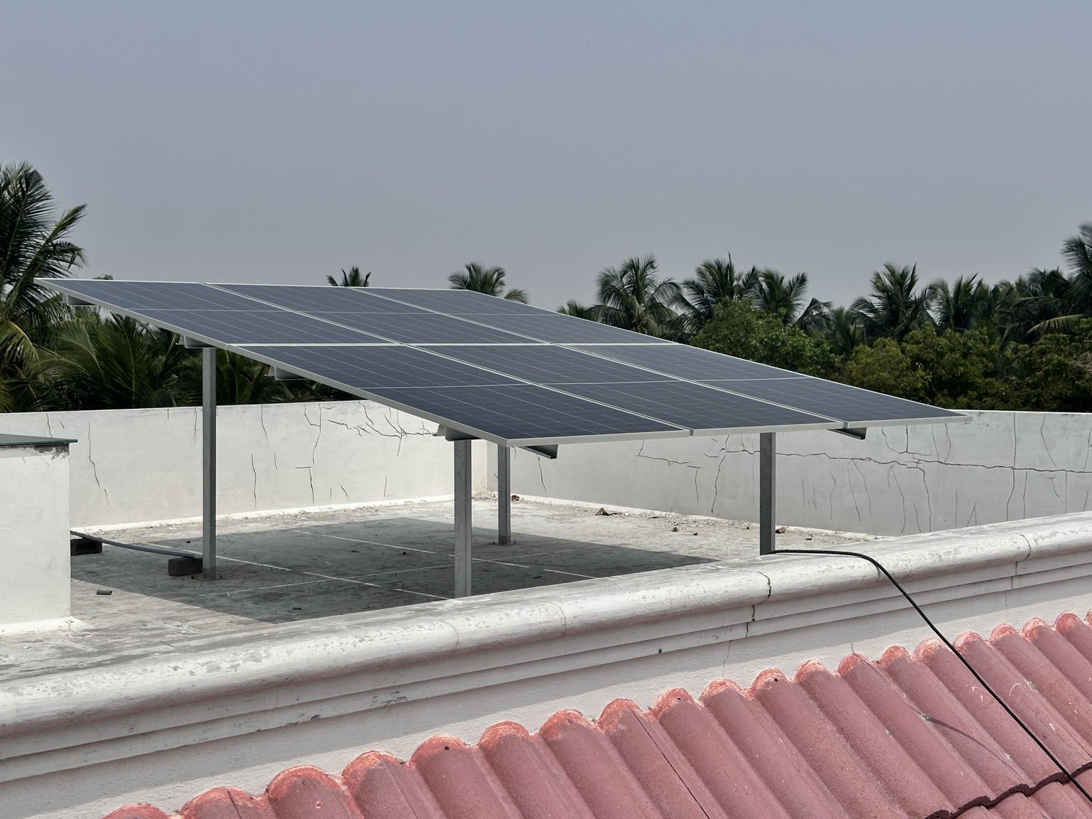 Elevated solar panels above a terrace