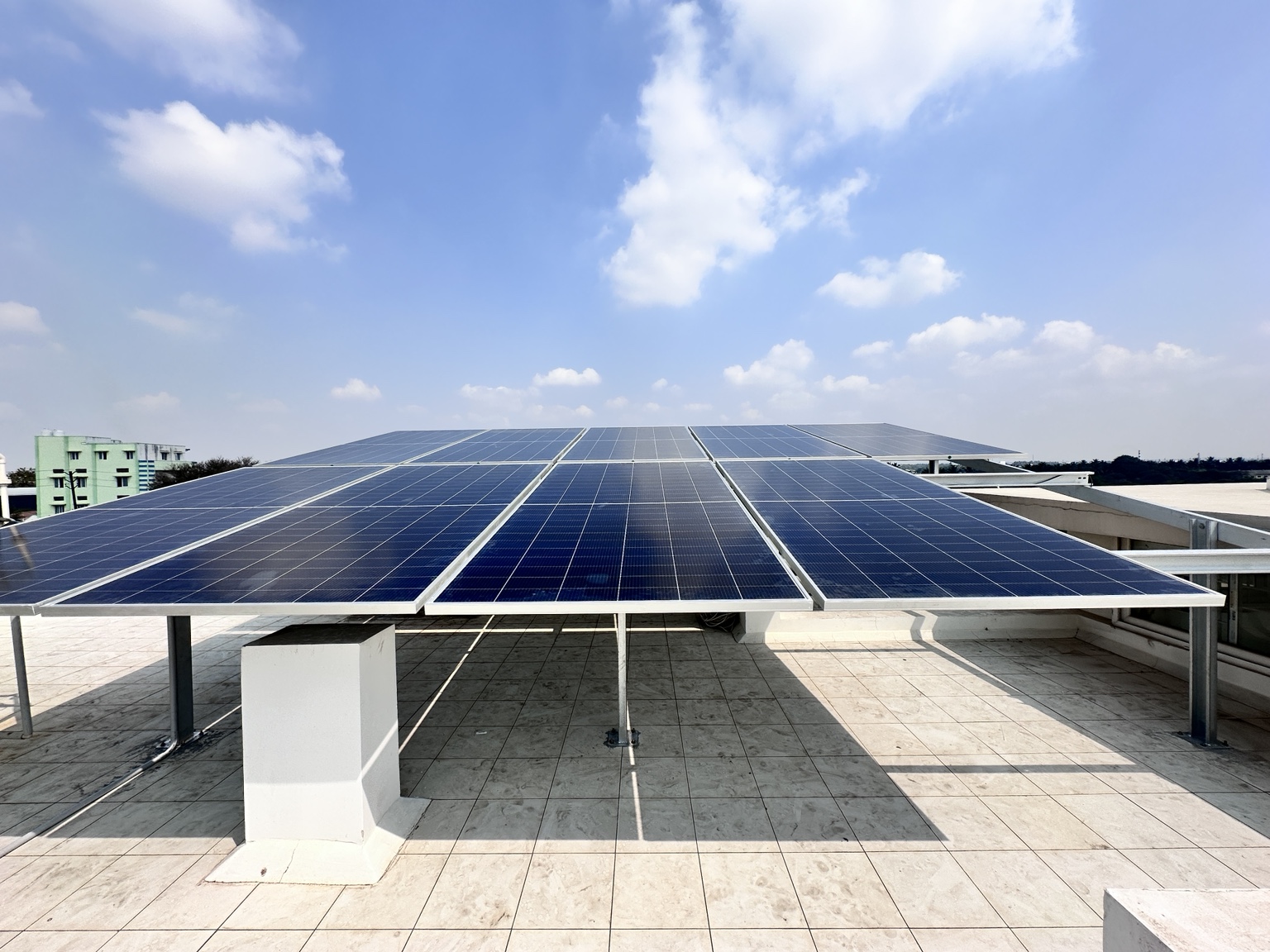 Solar panels above a tiled rooftop