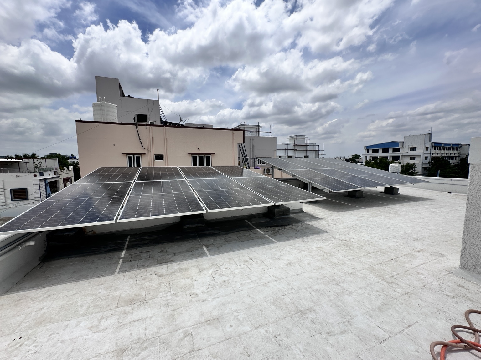 Solar panels installed across a flat rooftop